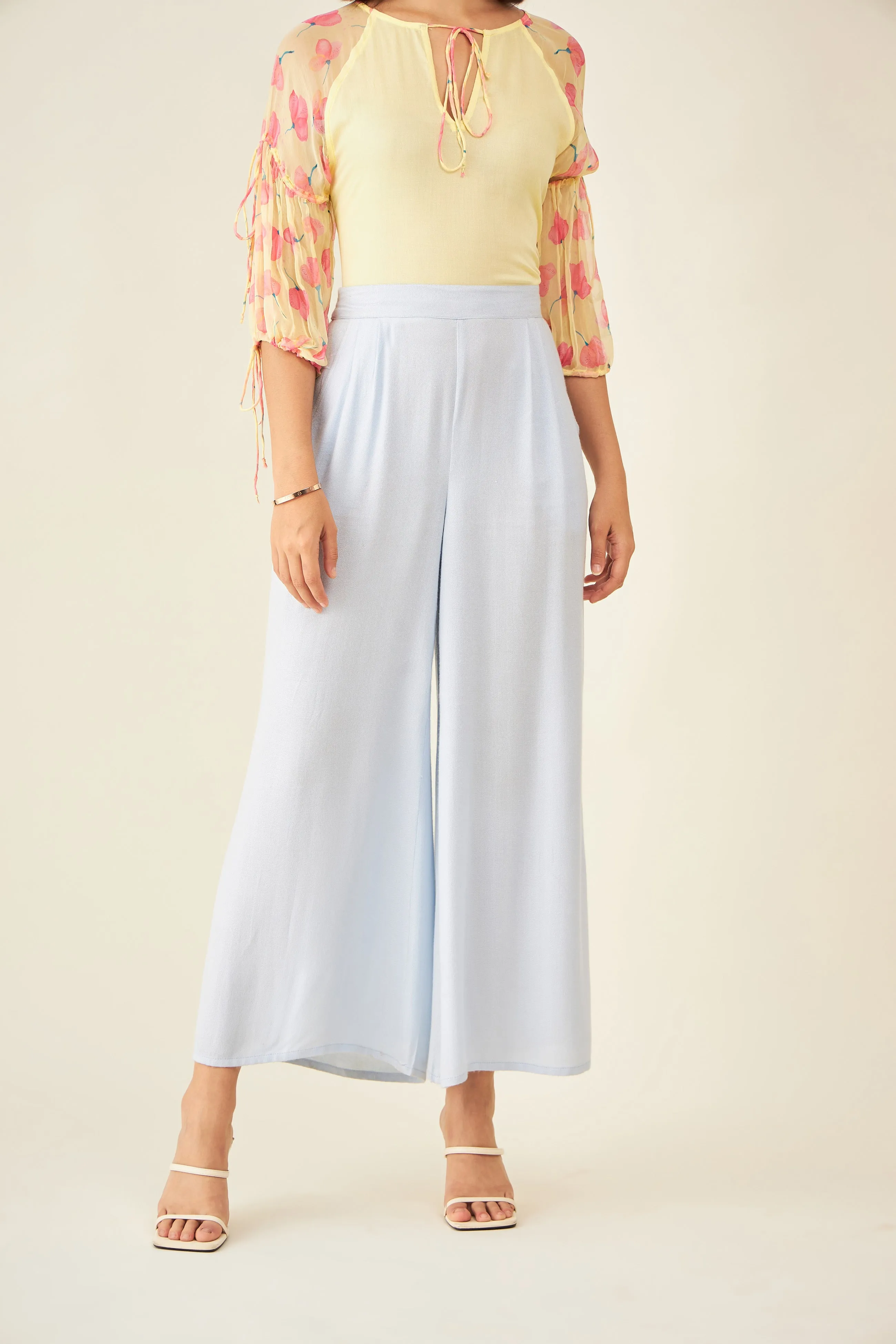 Light blue flared pants with side slit and pockets