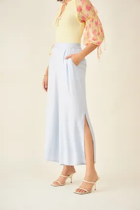 Light blue flared pants with side slit and pockets